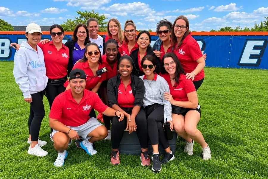 The Driftwood medical team posing together on a grassy camp field