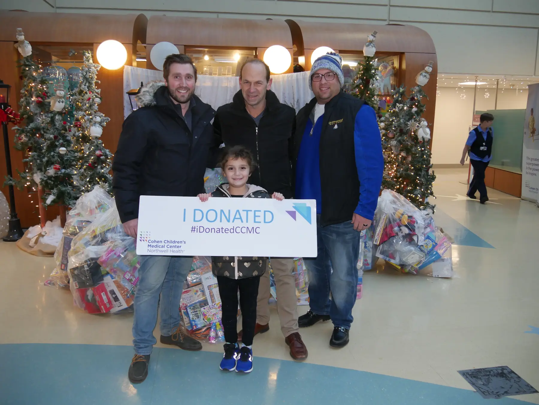 A Driftwood family delivering holiday toy donations